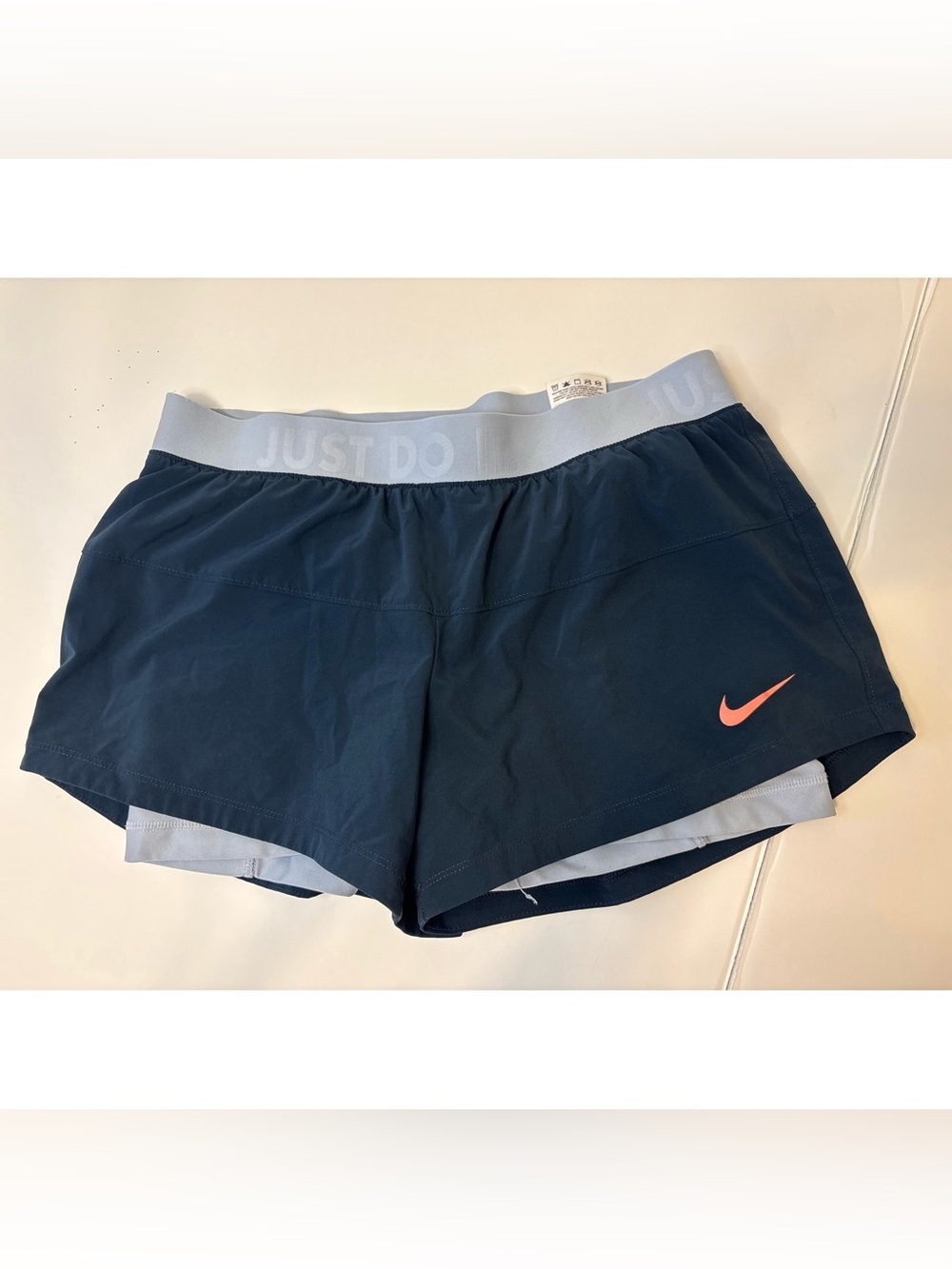 Nike Women’s Navy Athletic Shorts with Light Gray Waistband and Coral Swoosh
